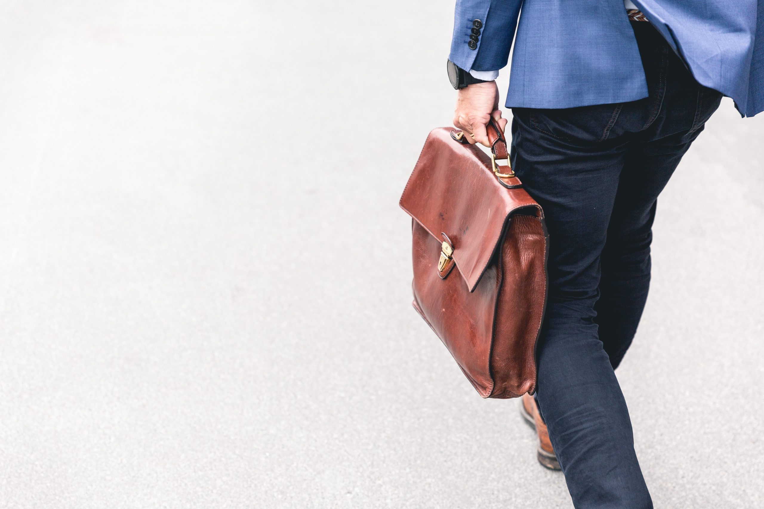 Businessman walking with briefcase